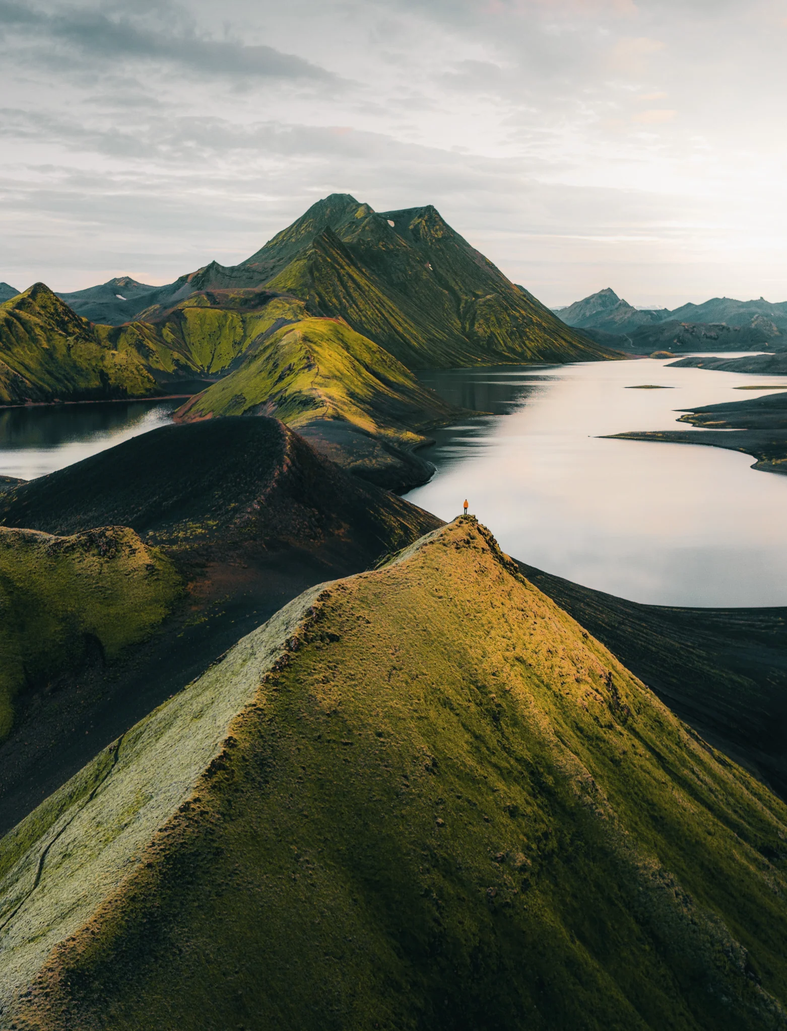 Emerald green ridges beneath clouds in the Icelandic Highlands