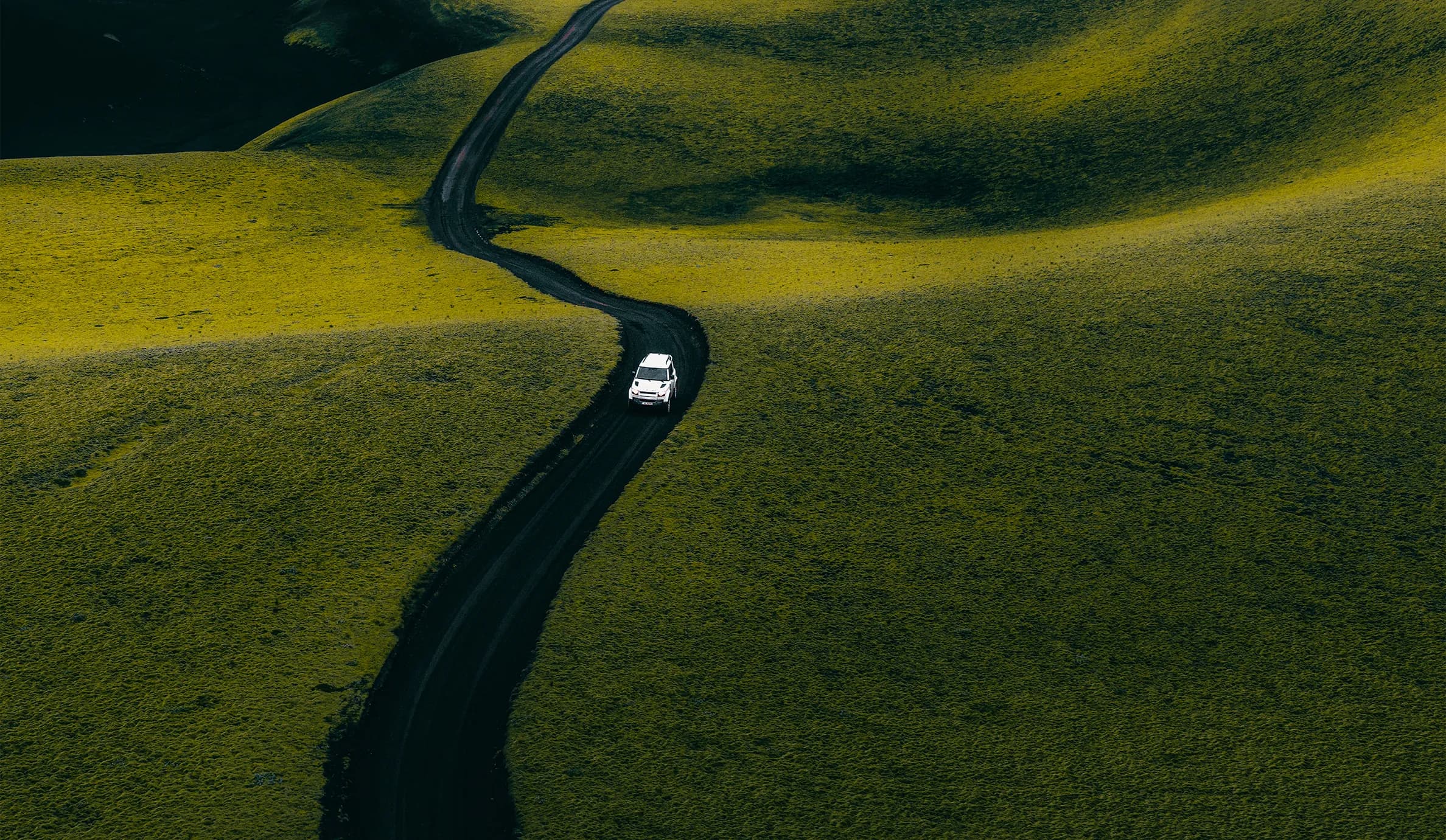 A car driving through the Icelandic landscape
